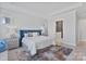 Comfortable main bedroom with hardwood floors, an ensuite bathroom and neutral paint at 1132 Meander Ln, Waxhaw, NC 28173