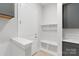 Inviting mud room featuring a built-in bench with storage and coat hooks at 1132 Meander Ln, Waxhaw, NC 28173