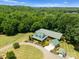 A beautiful estate with a long driveway, fenced pasture, outbuildings, and mature landscaping at 1363 John Cline Ct, Lincolnton, NC 28092