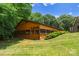 Image of spacious horse barn with green roof and screened windows at 1363 John Cline Ct, Lincolnton, NC 28092