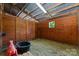 Rustic horse stall with wood paneling, hay, and ample space for equine comfort at 1363 John Cline Ct, Lincolnton, NC 28092