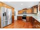 Well-equipped kitchen with stainless steel appliances, hardwood floors and ample cabinet space at 1363 John Cline Ct, Lincolnton, NC 28092