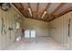 Functional laundry area equipped with washer, dryer, and water heater under a metal roof at 1363 John Cline Ct, Lincolnton, NC 28092