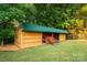 Image of new storage shed with tractor inside at 1363 John Cline Ct, Lincolnton, NC 28092