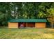 Image of new storage shed with two tractors inside at 1363 John Cline Ct, Lincolnton, NC 28092