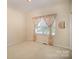 Neutral bedroom with carpet, window, and closet at 1730 Sanridge Wind Ln, Charlotte, NC 28262