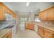 Spacious kitchen with generous counter space, bright cabinets, and stainless-steel appliances at 1730 Sanridge Wind Ln, Charlotte, NC 28262