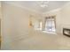 Bright living room featuring neutral carpet, a ceiling fan and a cozy fireplace at 1730 Sanridge Wind Ln, Charlotte, NC 28262