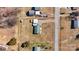 Aerial view of property showcasing layout with house, sheds, large yard, and proximity to the road at 1802 Young Dr, Conover, NC 28613