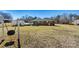 Wide backyard featuring a covered patio attached to the house, plus an outbuilding at 1802 Young Dr, Conover, NC 28613