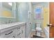 Compact bathroom featuring blue tile, white vanity, and standard fixtures at 1802 Young Dr, Conover, NC 28613