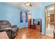 Bedroom with hardwood floors, television, and armchair at 1802 Young Dr, Conover, NC 28613