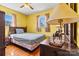 Bright bedroom with yellow walls, wood floors, and a classic bed and dresser set at 1802 Young Dr, Conover, NC 28613