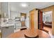 Bright kitchen with white cabinetry and appliances, adjacent to dining area and living room at 1802 Young Dr, Conover, NC 28613