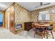 Cozy eat-in kitchen with wood table, floral wallpaper, and linoleum tile flooring at 1802 Young Dr, Conover, NC 28613