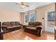 Cozy living room featuring hardwood floors, two sofas, and natural light from the windows at 1802 Young Dr, Conover, NC 28613