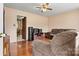 Comfortable living room with hardwood floors, sofa, and decorative wood entertainment center at 1802 Young Dr, Conover, NC 28613