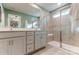 Modern bathroom with double vanity, tiled floors, and glass-enclosed shower at 212 Laura Elizabeth Ln, Clover, SC 29710