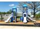 Community playground featuring slides, climbing structures, and a safety surface at 2577 Blue Sky Meadows Dr, Monroe, NC 28110