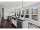 Bright kitchen features stainless appliances, a farmhouse sink, a breakfast bar, and lots of natural light at 33 Travora Cir, York, SC 29745