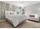 Bedroom with decoratively draped greenery, features neutral tones, and lots of light from the windows at 604 Wisteria Walk Way, Fort Mill, SC 29715