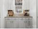 Charming butler's pantry with granite countertops, custom cabinetry, and decorative accents at 604 Wisteria Walk Way, Fort Mill, SC 29715