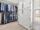 Well-organized walk-in closet with modern storage solutions, including custom shelving and hanging rods at 604 Wisteria Walk Way, Fort Mill, SC 29715