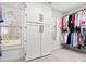 Spacious walk-in closet with built-in wardrobe, shelving and a large window at 604 Wisteria Walk Way, Fort Mill, SC 29715