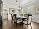 Elegant dining room featuring hardwood floors, stylish lighting, and a large window at 604 Wisteria Walk Way, Fort Mill, SC 29715