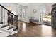 Inviting foyer featuring hardwood floors, decorative wainscoting, and a cozy seating area at 604 Wisteria Walk Way, Fort Mill, SC 29715