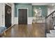 Elegant foyer with hardwood floors, a stylish console table, and beautiful wall decor at 604 Wisteria Walk Way, Fort Mill, SC 29715