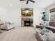 Spacious living room boasts a stone fireplace, plush seating, and abundant natural light at 604 Wisteria Walk Way, Fort Mill, SC 29715