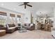 Open-concept living area with a fireplace, plush seating, and seamless flow to other rooms at 604 Wisteria Walk Way, Fort Mill, SC 29715
