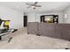Large living room featuring a sofa and entertainment center, adjacent to an exercise area at 604 Wisteria Walk Way, Fort Mill, SC 29715