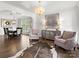 Bright living room with hardwood floors, chandelier, and elegant decor, perfect for entertaining and relaxation at 604 Wisteria Walk Way, Fort Mill, SC 29715