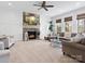 Cozy living room featuring a stone fireplace, plush seating, and large windows with a view at 604 Wisteria Walk Way, Fort Mill, SC 29715