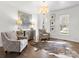 Bright living room with hardwood floors, decorative area rug, and comfortable seating at 604 Wisteria Walk Way, Fort Mill, SC 29715