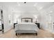 Serene main bedroom with a tray ceiling, neutral tones, and sophisticated decor at 604 Wisteria Walk Way, Fort Mill, SC 29715