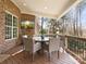 Covered outdoor dining area with comfortable seating, TV, and scenic views at 604 Wisteria Walk Way, Fort Mill, SC 29715