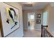 Hallway featuring modern art and a view into a bright, clean bathroom at 7020 Butternut Oak Ter, Huntersville, NC 28214