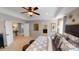 Expansive main bedroom leading to bathrooms and walk-in closets, featuring luxurious bedding at 7020 Butternut Oak Ter, Huntersville, NC 28214