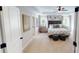 Spacious main bedroom featuring a tray ceiling, luxurious bedding, and elegant furniture at 7020 Butternut Oak Ter, Huntersville, NC 28214