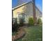 Exterior view of a home with a brick chimney and manicured bushes at 7144 Hunters Bluff Dr, Denver, NC 28037