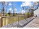 Spacious wooden back deck offering a great view of the well-manicured lawn and mature trees at 737 Sanside Dr, York, SC 29745