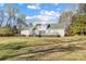 View of the expansive backyard and the rear exterior of the home featuring a deck at 737 Sanside Dr, York, SC 29745