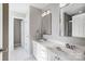 Bathroom boasts double sinks, a large mirror, and ample storage within the white vanity at 737 Sanside Dr, York, SC 29745