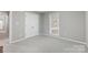 Carpeted bedroom with neutral colors, ample closet space, and natural light at 737 Sanside Dr, York, SC 29745