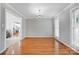 Dining room with elegant chandelier, hardwood floors, and large window at 737 Sanside Dr, York, SC 29745