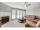 Inviting living room featuring a fireplace, ceiling fan and ample natural light at 737 Sanside Dr, York, SC 29745