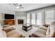 Spacious living room featuring a fireplace, ceiling fan and ample seating at 737 Sanside Dr, York, SC 29745